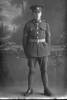 Full length portrait of Corporal (later Sergeant) Lewis Cyril Cheeseman, Reg No 18906, of the Auckland Infantry Battalion, - A Company, 15th Reinforcements. (Photographer: Herman Schmidt, 1916). Sir George Grey Special Collections, Auckland Libraries, 31-C1507. No known copyright.