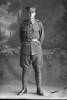 Full length portrait of Private John George Cannon, Reg No 28670, of the Auckland Infantry Battalion, - A Company, 18th Reinforcements. (Photographer: Herman Schmidt, 1916). Sir George Grey Special Collections, Auckland Libraries, 31-C1934. No known copyright.