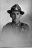 1/4 portrait of Gunner Charles Caradus, Reg No 17620, of the New Zealand Field Artillery (Photographer: Herman Schmidt, 1916). Sir George Grey Special Collections, Auckland Libraries, 31-C1936. No known copyright.