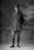 Full length portrait of Chaplain Captain Henry Steele Craik, Reg No 35599, of the Chaplain Corps (Photographer: Herman Schmidt, 1916). Sir George Grey Special Collections, Auckland Libraries, 31-C2256. No known copyright.