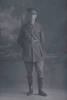 Full length portrait of Chaplain Captain Henry Steele Craik, Reg No 35599, of the Chaplain Corps (Photographer: Herman Schmidt, 1916). Sir George Grey Special Collections, Auckland Libraries, 31-C2257. No known copyright.