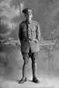 Full length portrait of Private (later Lance Corporal) Walter Perry Cartwright, Reg No 44700, of the Auckland Infantry Battalion, - A Company, 24th Reinforcements. (Photographer: Herman Schmidt, 1917). Sir George Grey Special Collections, Auckland Libraries, 31-C2695. No known copyright.