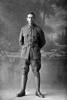 Full length portrait of Private Erni Bond, Reg No 44680, Auckland Infantry Regiment, - A Company, 24th Reinforcements. Killed in action in France 4 Oct 1917. Battle of Passchendaele. (Photographer: Herman Schmidt, 1917). Sir George Grey Special Collections, Auckland Libraries, 31-B3007. No known copyright.