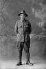 Full length portrait of Trooper Stanley Martyn Barriball, Reg No 43180, New Zealand Mounted Rifles, 26th Reinforcements. (Photographer: Herman Schmidt, 1917). Sir George Grey Special Collections, Auckland Libraries, 31-B3041. No known copyright.