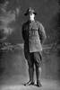 Full length portrait of Corporal Harry Forsyth Connelly, Reg No 46225, of the Auckland Infantry Regiment, - A Company, 29th Reinforcements. (Photographer: Herman Schmidt, 1917). Sir George Grey Special Collections, Auckland Libraries, 31-C3640. No known copyright.