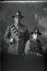 Group portrait of two gunners with the New Zealand Field Artillery, one is Gunner Ernest Edward Elley, Reg No 42918, and one is wearing a New Zealand Returned Soldiers Association badge (Photographer: Herman Schmidt, 1917). Sir George Grey Special Collections, Auckland Libraries, 31-E3110. No known copyright.