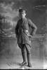 Full length portrait of 2nd Lieutenant Stanley James Davis of the Otago Infantry Regiment, - D Company, 18th Reinforcements. (Photographer: Herman Schmidt, 1916). Sir George Grey Special Collections, Auckland Libraries, 31-D1955. No known copyright.