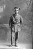 Full length portrait of 2nd Lieutenant George Robert Dansey, Reg No 33004, of the Maori Contingent, 14th Reinforcements. New Zealand Maori Pioneer Battalion. (Photographer: Herman Schmidt, 1917). Sir George Grey Special Collections, Auckland Libraries, 31-D2737. No known copyright.