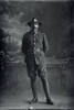 Full length portrait of Private John Stanley Daubeny, Reg No 52387, of the 27th Reinforcements, E Company. (Photographer: Herman Schmidt, 1917). Sir George Grey Special Collections, Auckland Libraries, 31-D3081. No known copyright.