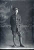Full length portrait of Private Vincent Raymond Dingle of the Auckland Infantry Regiment, - A Company, 27th Reinforcements. (Photographer: Herman Schmidt, 1917). Sir George Grey Special Collections, Auckland Libraries, 31-D3095. No known copyright.