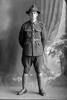 Full length portrait of Private George Henry Charles Dunnett, Reg No 46445, of the 33rd Reinforcements, E Company. (Photographer: Herman Schmidt, 1917). Sir George Grey Special Collections, Auckland Libraries, 31-D3647. No known copyright.