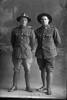 Full length portrait of Private Denaze (right), probably Private Alvin Lawrence Denize, Reg No 56265, of the Auckland Infantry Regiment, - A Company, and a friend, both of the 29th Reinforcements. (Photographer: Herman Schmidt, 1917). Sir George Grey Special Collections, Auckland Libraries, 31-D3661. No known copyright.