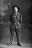 Full length portrait of Private Denaze of the 29th Reinforcements, probably Private Alvin Lawrence Denize, Reg No 56265, of the Auckland Infantry Regiment, - A Company, (Photographer: Herman Schmidt, 1917). Sir George Grey Special Collections, Auckland Libraries, 31-D3663. No known copyright.