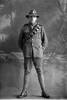 Full length portrait of Private John Glasson, Reg No 25068, of the New Zealand Engineers, Divisional Signallers, New Zealand Signal Corps. (Photographer: Herman Schmidt, 1916). Sir George Grey Special Collections, Auckland Libraries, 31-G490. No known copyright.