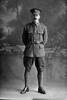 Full length portrait of Private William Fordyce, Reg No 42314, of the Auckland Infantry Regiment, - A Company, 24th Reinforcements. (Photographer: Herman Schmidt, 1917). Sir George Grey Special Collections, Auckland Libraries, 31-F2600. No known copyright.