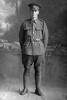 Full portrait of W J Henderson, probably Walter James Henderson, Reg no. 42329, Auckland Infantry Regiment - A Company, 23rd Reinforcements (Photographer: Herman Schmidt, 1917). Sir George Grey Special Collections, Auckland Libraries, 31-H3129. No known copyright.