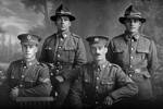 Group portrait of four men, all of the 19th Reinforcements, including, on the left, is Corporal Henry Archibald Basil Cruller, Reg No 31401, of J Company, killed in action in France on 12 October 1917 at the Battle of Passchendaele. On the right is Private Robert Henry Flavell, Reg No 31407, also of J Company. (Photographer: Herman Schmidt, 1916). Sir George Grey Special Collections, Auckland Libraries, 31-F2627. No known copyright.