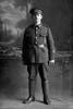 Full length portrait of Private A D Jackson with the 3rd (Auckland) Regiment, Auckland Infantry Regiment. (Photographer: Herman Schmidt, 1916). Sir George Grey Special Collections, Auckland Libraries, 31-J1867. No known copyright.