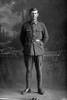 Full length portrait of Albert Edwin James Greenwood, Reg No 52414, of the 27th Reinforcements, E Company. (Photographer: Herman Schmidt, 1917). Sir George Grey Special Collections, Auckland Libraries, 31-G3721. No known copyright.