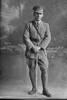 Full length portrait of Lieutenant John Hines, Reg No 23749, of the Specialist Company (Signal Section). Born in Australia. (Photographer: Herman Schmidt, 1916). Sir George Grey Special Collections, Auckland Libraries, 31-H608. No known copyright.