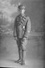 Full length portrait of Rifleman John Richard Hodgkinson, Reg No 26/1062, of the New Zealand Signal Corps, New Zealand Rifle Brigade. (Photographer: Herman Schmidt, 1916). Sir George Grey Special Collections, Auckland Libraries, 31-H619. No known copyright.