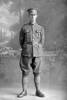 Full length portrait of Sergeant (later 2nd Lieutenant in the nominal rolls) Alfred Cecil Christopher Hunter, Reg No 18216, of the 10th Reinforcements to the 2nd Battalion, - F Company, New Zealand Rifle Brigade. (Photographer: Herman Schmidt, 1916). Sir George Grey Special Collections, Auckland Libraries, 31-H655. No known copyright.