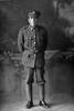 Full length portrait of Private Harrison. Probably Rifleman George Edward Harrison, Reg No 29398, of the 12th Reinforcements to the 1st Battalion, - E Company. New Zealand Rifle Brigade. 18th Reinforcements (Photographer: Herman Schmidt, 1916). Sir George Grey Special Collections, Auckland Libraries, 31-H2026. No known copyright.