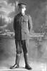 Full length portrait of Private Charles Linder, Reg No 21034, of 10th Reinforcements to the 1st Battalion, - E Company, New Zealand Rifle Brigade, but wearing the badges of the 16th (Waikato) Regiment. Later a Lance Corporal. Born in Australia, killed in action in France on 21 August 1918. (Photographer: Herman Schmidt, 1916). Sir George Grey Special Collections, Auckland Libraries, 31-L2824. No known copyright.
