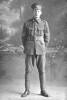 Full length portrait of Corporal Walter Eric Lippiatt, Reg No 14449, of the 2nd Battalion, Auckland Infantry Regiment (Previously identified as Sergeant George Edward Kenneth Lippiatt, Reg No 26865, of the 3rd (Auckland) Regiment, Auckland Infantry Regiment, - A Company, 17th Reinforcements.) (Photographer: Herman Schmidt, 1916). Sir George Grey Special Collections, Auckland Libraries, 31-L716. No known copyright.