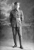 Full length portrait of Corporal Walter Eric Lippiatt Reg No 14449, 2nd Battalion, Auckland Infantry Regiment (Previously identified as Sergeant George Edward Kenneth Lippiatt, Reg No 26865, of the 3rd (Auckland) Regiment, Auckland Infantry Regiment, - A Company, 17th Reinforcements.) (Photographer: Herman Schmidt, 1916). Sir George Grey Special Collections, Auckland Libraries, 31-L718. No known copyright.