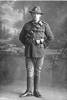 Full length portrait of Trooper Louis Lennan, Reg No 16101, of the New Zealand Mounted Rifles, Mounted Machine Gun Section. (Photographer: Herman Schmidt, 1916). Sir George Grey Special Collections, Auckland Libraries, 31-L1739. No known copyright.