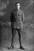 Full length portrait of Private Gordon Menzies of the Auckland Infantry Battalion, - A Company, 14th Reinforcements. Born in Australia. (Photographer: Herman Schmidt, 1916). Sir George Grey Special Collections, Auckland Libraries, 31-M791. No known copyright.