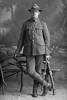 Full length portrait of Mr Mettrick of the 16th (Waikato) Regiment, probably Lance Corporal James Mettrick, Reg No 12/788, of the Auckland Infantry Regiment, Main Body. (Photographer: Herman Schmidt, 1915). Sir George Grey Special Collections, Auckland Libraries, 31-M797. No known copyright.