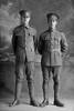 Full length portrait of 2 men of the 3rd (Auckland) Regiment, Auckland Infantry Regiment, one a private and the other is Quartermaster Sergeant Arnold Edgar Mills, Reg No 13/3732, A Company. Killed in action in France on 7 July 1916. (Photographer: Herman Schmidt, 1915|1916). Sir George Grey Special Collections, Auckland Libraries, 31-M812. No known copyright.
