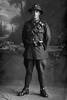 Full length portrait of Trooper James William Henry Mitchell, Reg No 24914, attached to the New Zealand Mounted Rifles, 14th Reinforcements. (Photographer: Herman Schmidt, 1916). Sir George Grey Special Collections, Auckland Libraries, 31-M816. No known copyright.