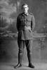 Full length portrait of Private George William Morrison, Reg No 12/4223, of the Auckland Infantry Battalion, - A Company, 11th Reinforcements. Died after discharge from the N.Z.E.F. from wounds inflicted or disease contracted while on active service, on 20 November 1918. (Photographer: Herman Schmidt, 1916). Sir George Grey Special Collections, Auckland Libraries, 31-M849. No known copyright.