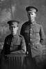 3/4 group portrait of Rifleman Edward Montgomery, Reg No 44652 (standing), and his brother Rifleman John Montgomery, Reg No 44653 (seated), both of the New Zealand Rifles Brigade, J Company, 24th Reinforcements. Edward was killed in action in France on 21st November 1917. (Photographer: Herman Schmidt, 1917). Sir George Grey Special Collections, Auckland Libraries, 31-M3206. No known copyright.