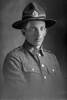 1/4 portrait of Rifleman William Henry Mills, Reg No 62609, of the New Zealand Rifle Brigade, G Company. (Photographer: Herman Schmidt, 1917). Sir George Grey Special Collections, Auckland Libraries, 31-M3858. No known copyright.