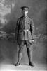 Full length portrait of Lance Corporal (Corporal in the roll) Sydney Herbert Norman of the 23rd Reinforcements, - E Company. Born in Australia. (Photographer: Herman Schmidt, 1917). Sir George Grey Special Collections, Auckland Libraries, 31-N2878. No known copyright.