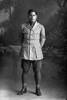 Full length portrait of Corporal Harry, probably (private in the roll) Purie Dave Harry, Reg No 16/1371, of the 3rd Maori Contingent, Rarotongans, New Zealand Maori Pioneer Battalion. (Photographer: Herman Schmidt, 1916). Sir George Grey Special Collections, Auckland Libraries, 31-H2290. No known copyright.