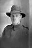 1/4 portrait of Private Pirritt (?) of the New Zealand Medical Corps, possibly William Deans Pirrett, Reg No 3/2690, or John Cameron Pirrit, Reg No 3/1789. (Photographer: Herman Schmidt, 1916). Sir George Grey Special Collections, Auckland Libraries, 31-P911. No known copyright.