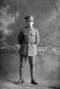 Full length portrait of Lance Corporal Albert John Phillips, Reg No 16205, a signaller with the Auckland Infantry Battalion, - A Company, 14th Reinforcements. (Photographer: Herman Schmidt, 1916). Sir George Grey Special Collections, Auckland Libraries, 31-P921. No known copyright.