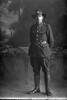 Full length portrait of Private Clarence Henry Pegler, Reg No 51980, of the Canterbury Infantry Regiment, - C Company, 27th Reinforcements. (Photographer: Herman Schmidt, 1917). Sir George Grey Special Collections, Auckland Libraries, 31-P3454. No known copyright.