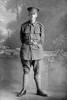 Full length portrait of Private Kenneth Ray, Reg No 12/4078, with the Auckland Infantry Battalion, - A Company, 10th Reinforcements. (Photographer: Herman Schmidt, 1916). Sir George Grey Special Collections, Auckland Libraries, 31-R953. No known copyright.
