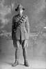 Full length portrait of Corporal Malcolm Robb, Reg No 2/2709, of the New Zealand Field Artillery. (Photographer: Herman Schmidt, 1916). Sir George Grey Special Collections, Auckland Libraries, 31-R970. No known copyright.