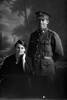 3/4 portrait of Private Ryan of the 14th Reinforcements, A Company, and a woman. Possibly Percy Joseph Ryan, Reg No 14486, and his wife Phoebe Violet Lily Ryan. (Photographer: Herman Schmidt, 1916). Sir George Grey Special Collections, Auckland Libraries, 31-R2097. No known copyright.