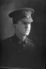 1/4 portrait of Rifleman Bernard Richard William Roydhouse, Reg No 25742, of the New Zealand Rifle Brigade, 8th Reinforcements to the 3rd Battalion, - G Company. (Photographer: Herman Schmidt, 1916). Sir George Grey Special Collections, Auckland Libraries, 31-R2461. No known copyright.