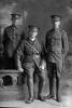 Full length portrait of 3 men including Captain James Arthur Shand, Reg No 12/4304, of the Auckland Infantry Regiment, A Company, 11th Reinforcements, and a corporal with the 6th (Hauraki) Regiment, Auckland Infantry Regiment, and a private with the New Zealand Railway Corps. (Photographer: Herman Schmidt, 1916). Sir George Grey Special Collections, Auckland Libraries, 31-S1025. No known copyright.