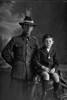 3/4 group portrait of Private Bert Stanton, of the New Zealand Army Service Corps, and his nephew, Alex Owens. (Photographer: Herman Schmidt, 1916). Sir George Grey Special Collections, Auckland Libraries, 31-S1138. No known copyright.