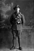 Full length portrait of Trooper Allan Satchell, Reg No 16342, of the New Zealand Mounted Rifles, Mounted Signal Section. (Photographer: Herman Schmidt, 1916). Sir George Grey Special Collections, Auckland Libraries, 31-S2137. No known copyright.